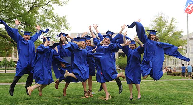 新澳门六合彩资料 University graduates leap in celebration on the Quad